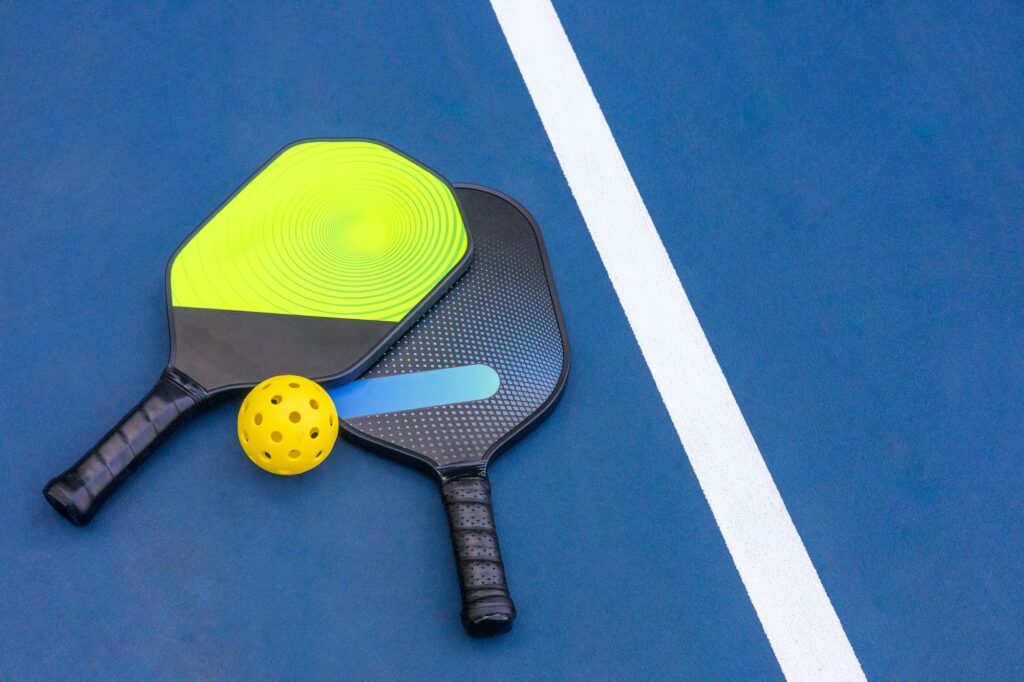 Pickleball Racquet's on blue court